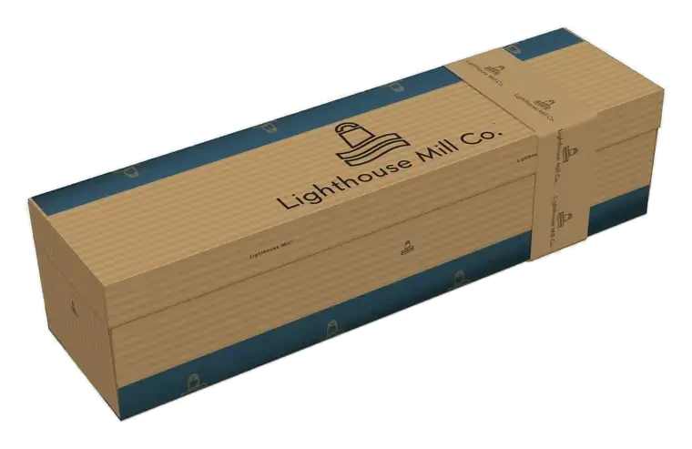 The single Lighthouse Mill box, closed, in natural kraft with a sea blue printed band